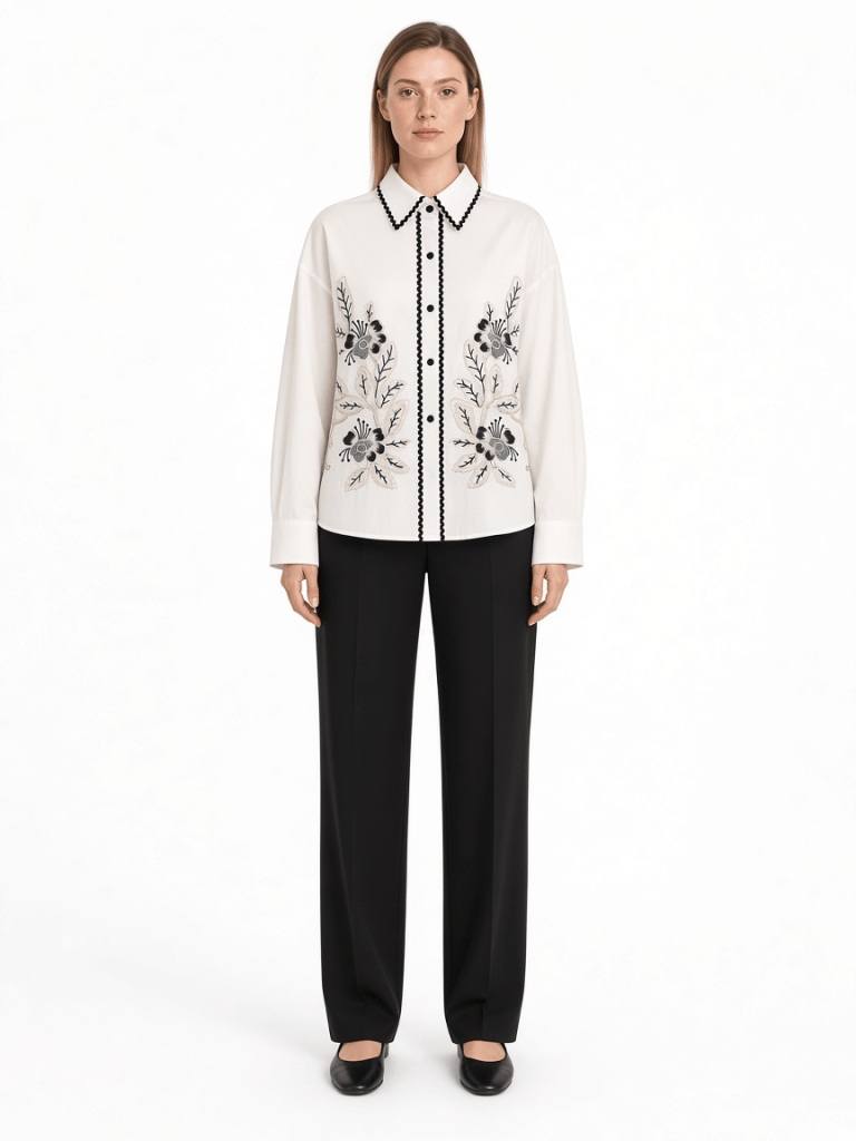 FM-LK-037 white long-sleeve floral shirt with black trim at the collar and button placket on a model