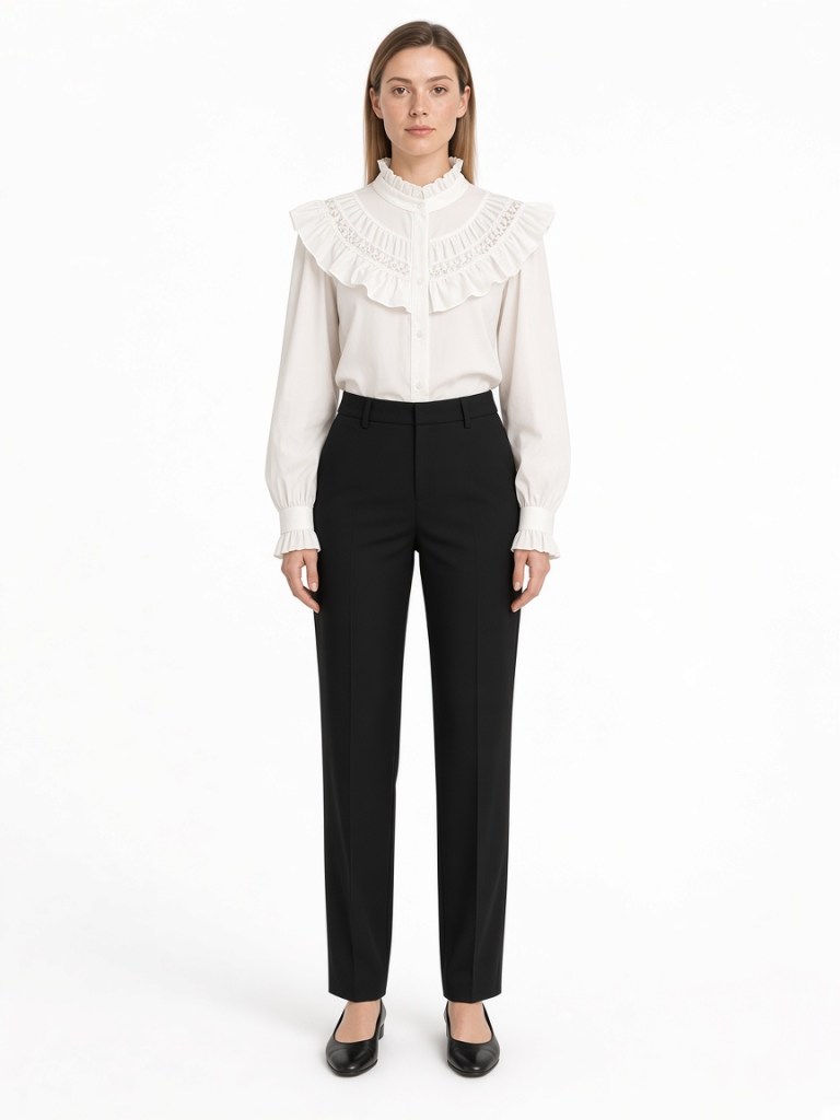 FM-LK-041 White blouse with a ruffled high neckline, broad ruffle yoke, decorative openwork inserts, button front and gathered cuffs shown on a model
