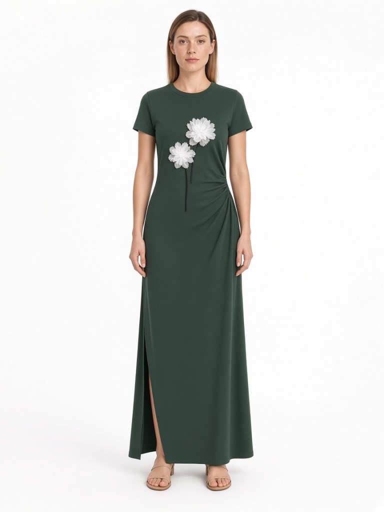 FM-LK-050 Dark green crew-neck maxi dress with short sleeves, white floral front motifs, gathered side detail and a side slit shown on a model